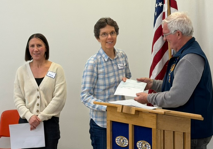 Dave Hiller presenting Kiwanis award check to Theresa Slavkovsky and Jaclyn Kordell
